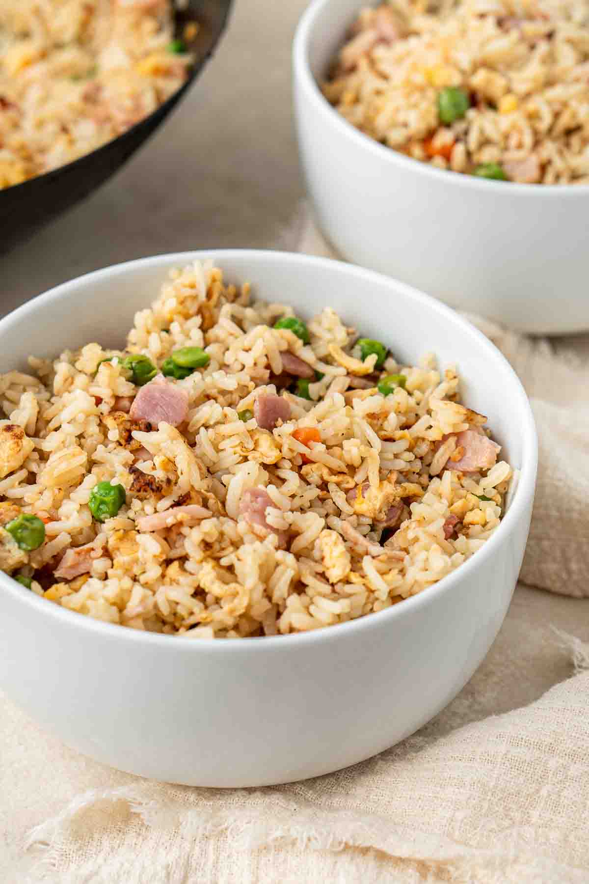 Fried rice served in white bowls. 