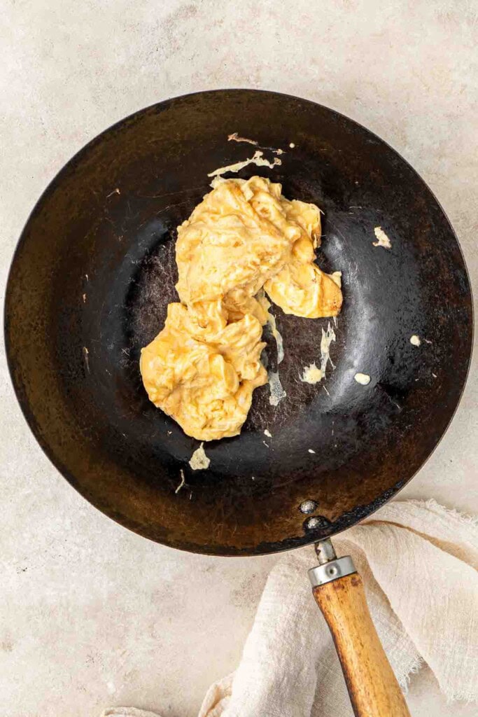 Scrambled egg in a wok.