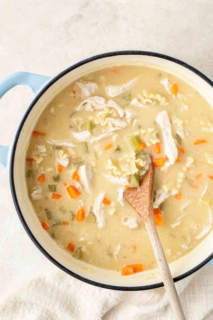 The white sauce and chicken added back into the chicken soup.