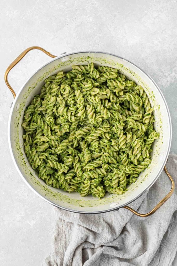 Spinach pesto pasta in a large pot.