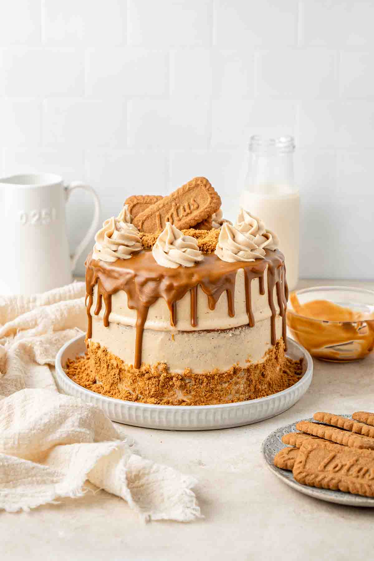 Dairy free biscoff cake decorated with a biscoff drip.