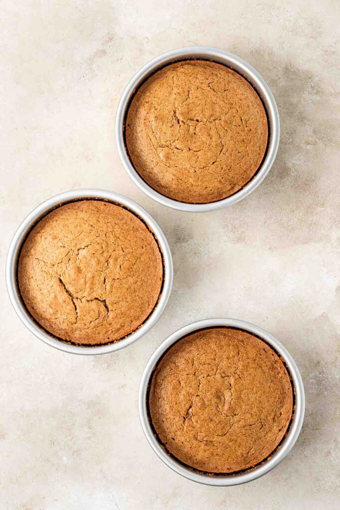 The three cooked cakes in cake tins.