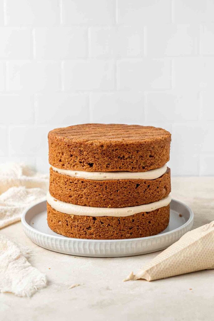 Three biscoff cake layers together with buttercream.
