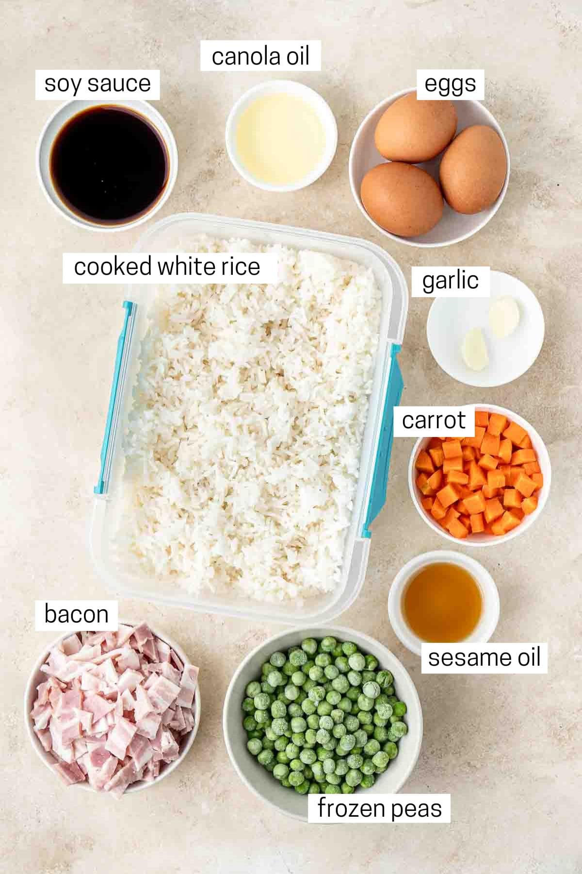 All ingredients needed for budget fried rice laid out in bowls.