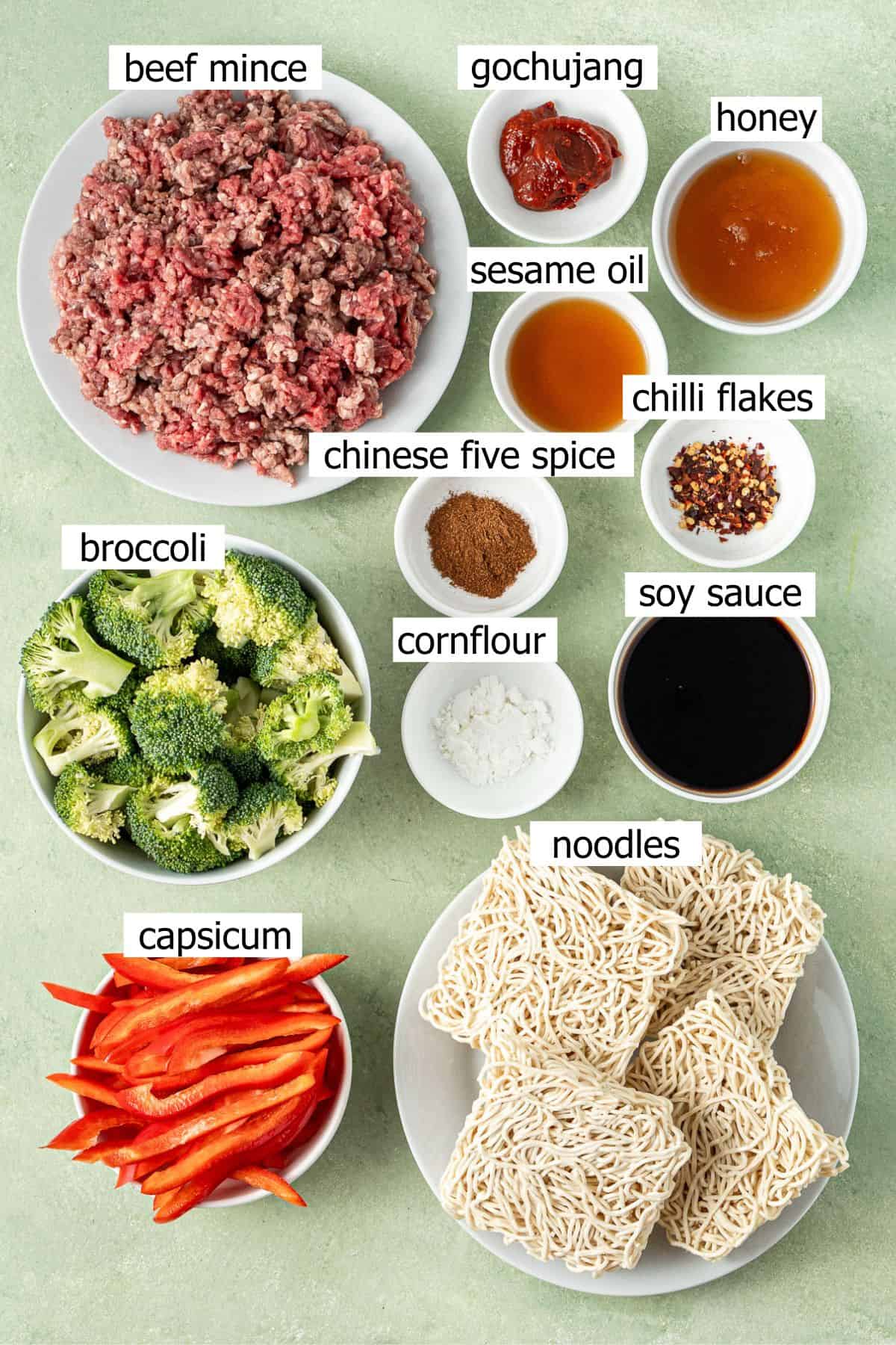 All ingredients needed to make chilli beef noodles laid out in small bowls.
