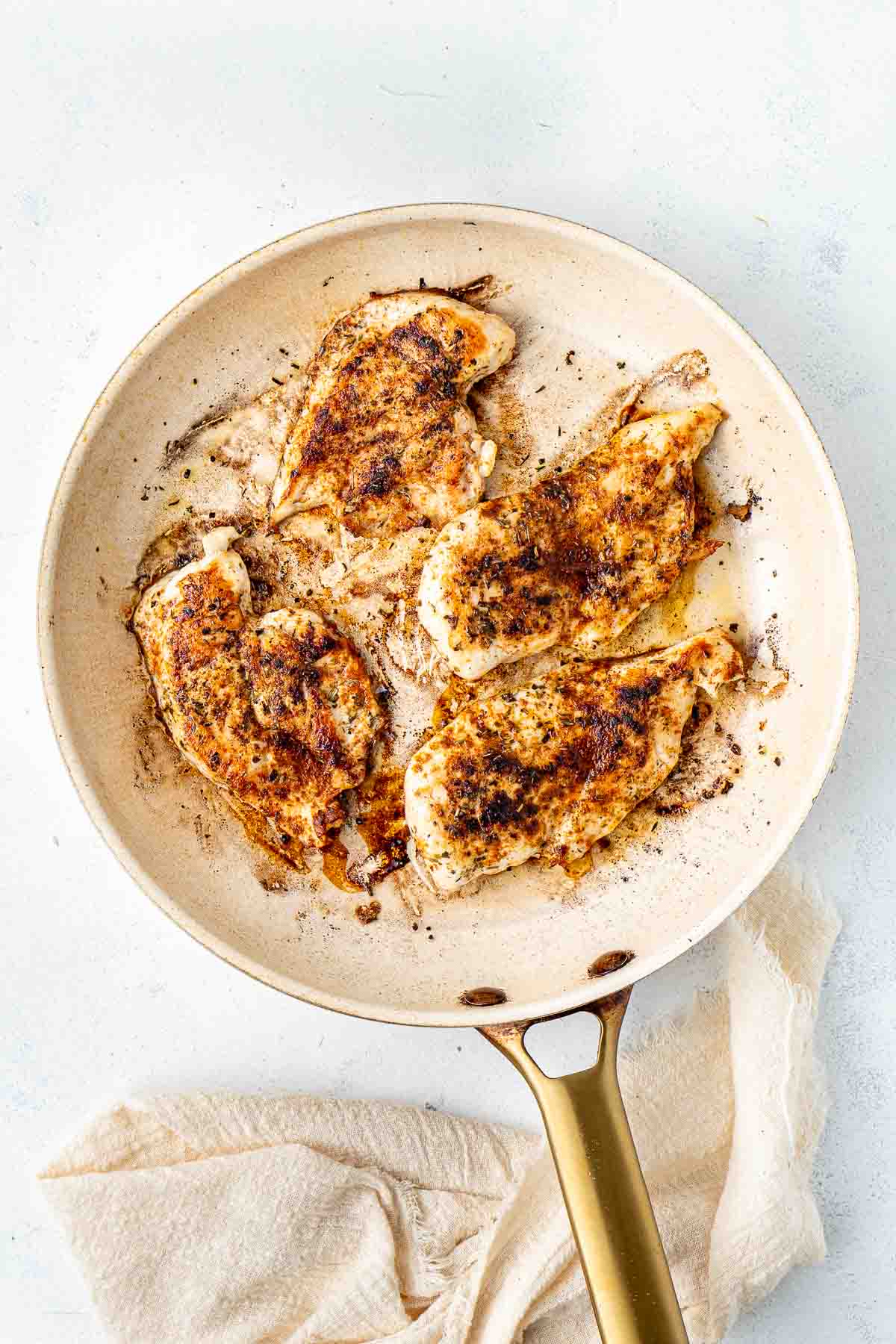 Grilled chicken in a frying pan.