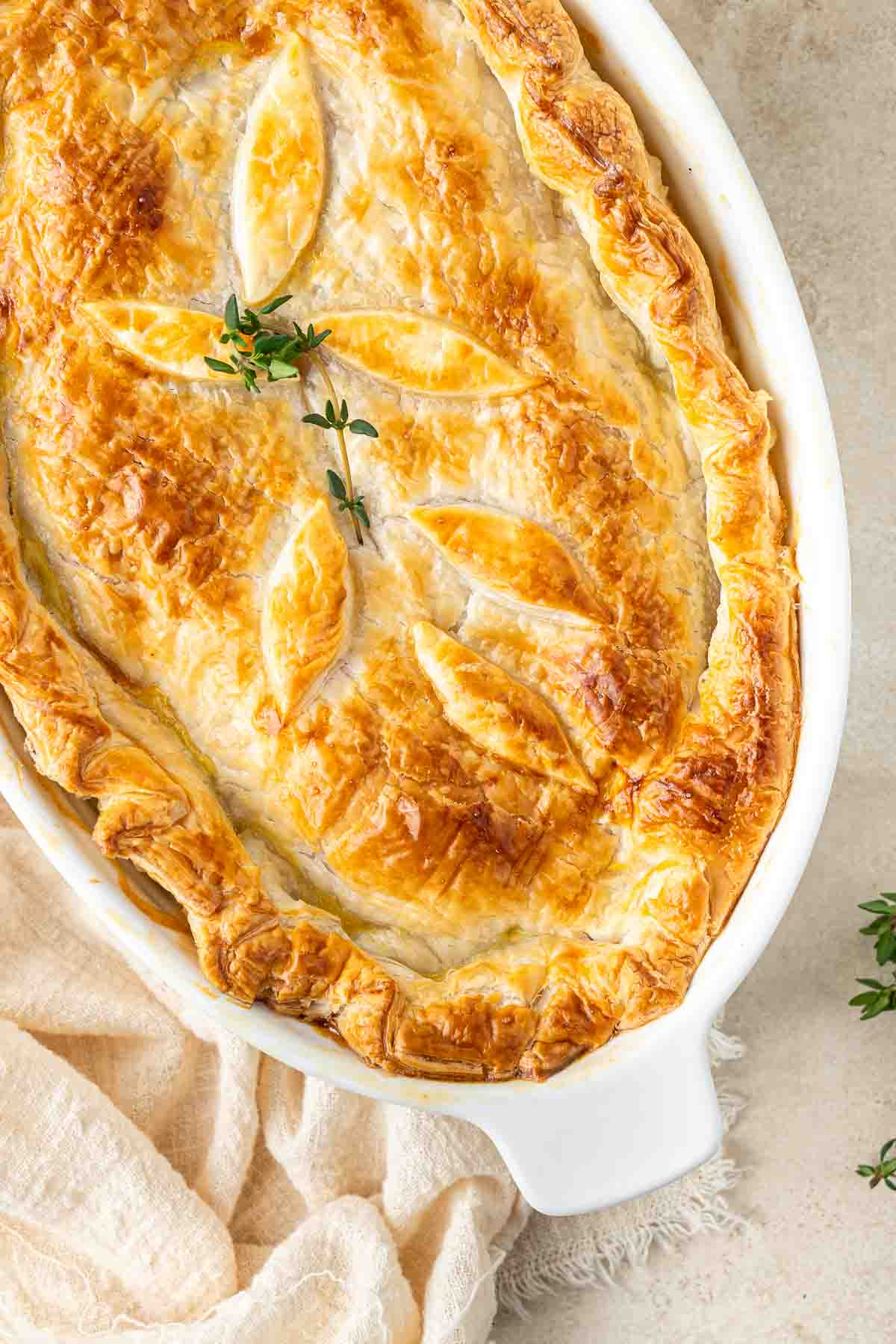 The cooked chicken pot pie with golden pastry.