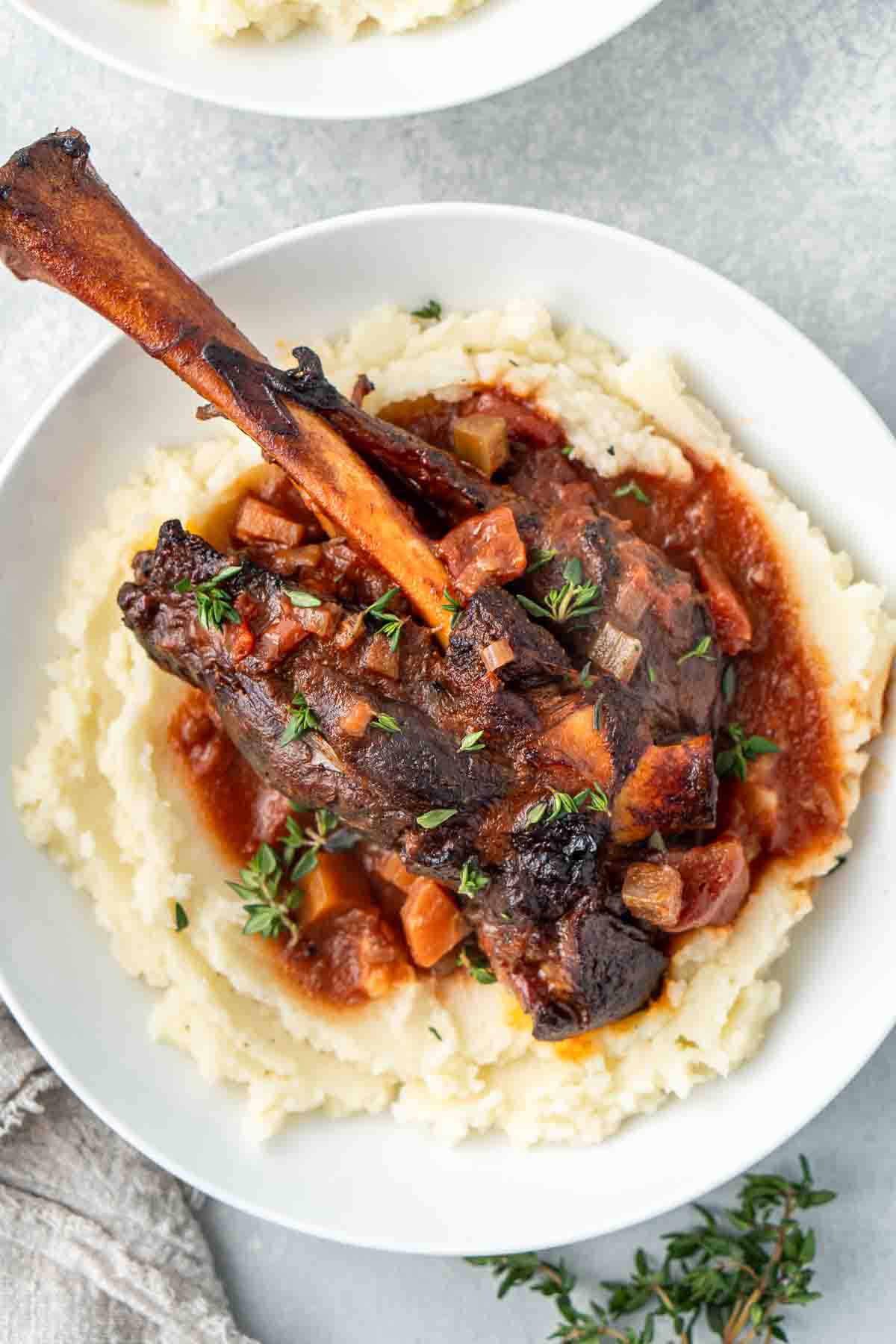 Close up of braised lamb shanks.