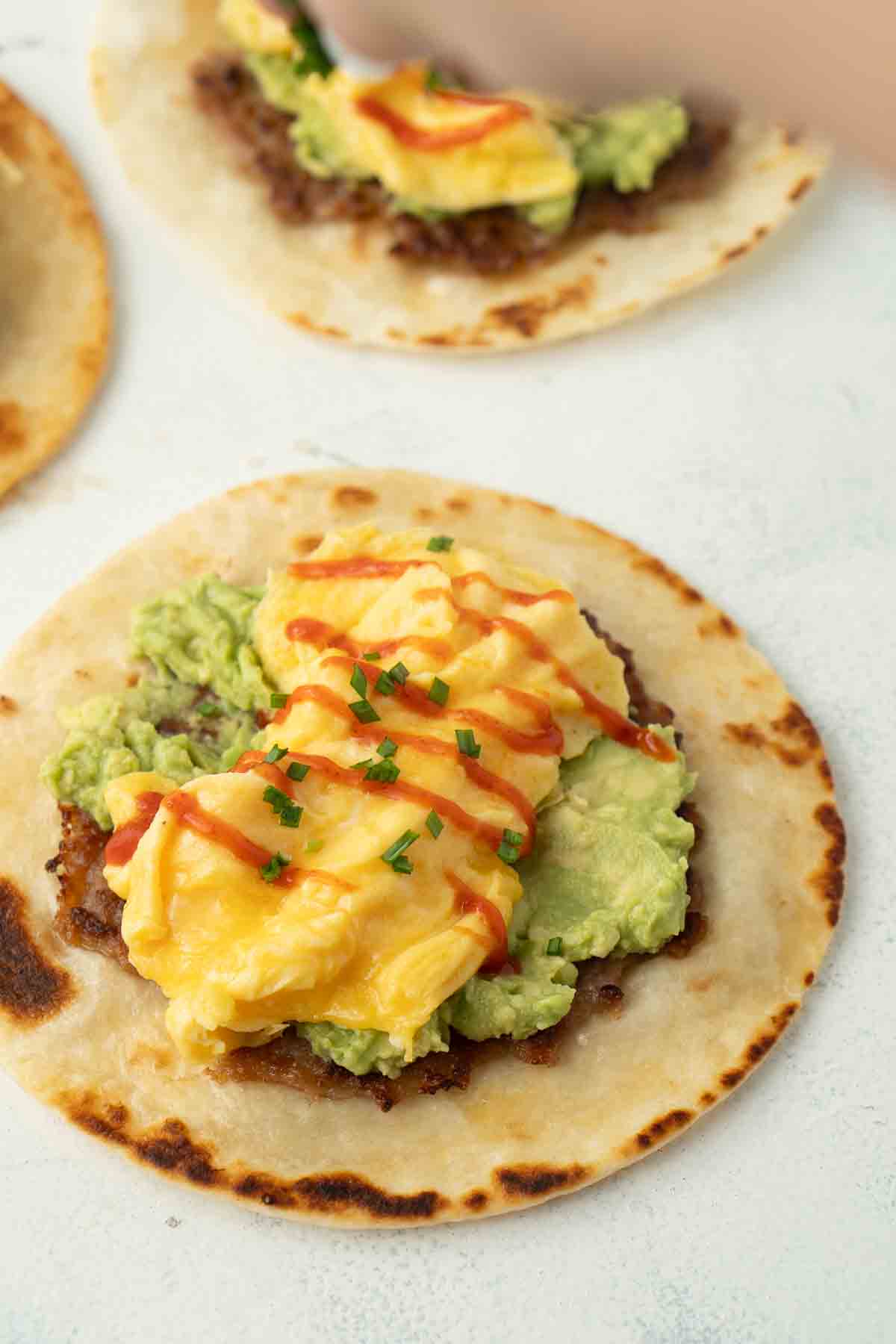 Sausage, egg and avocado breakfast tacos.