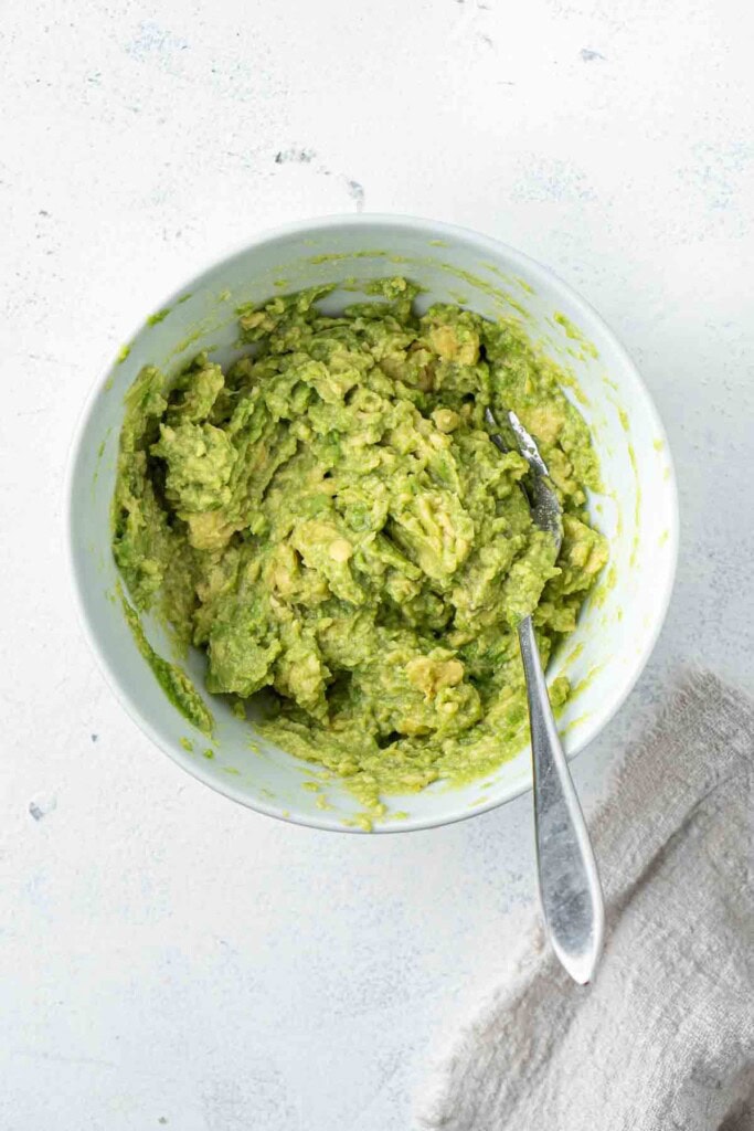 Smashed avocado in a bowl.