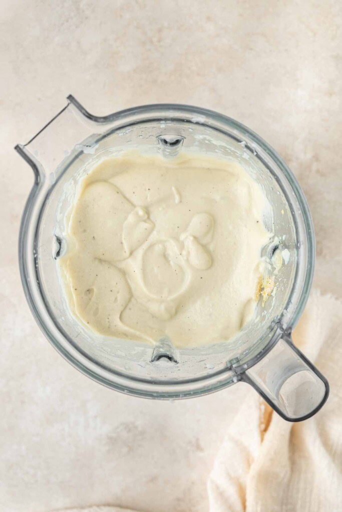 Cauliflower alfredo sauce in a blender.