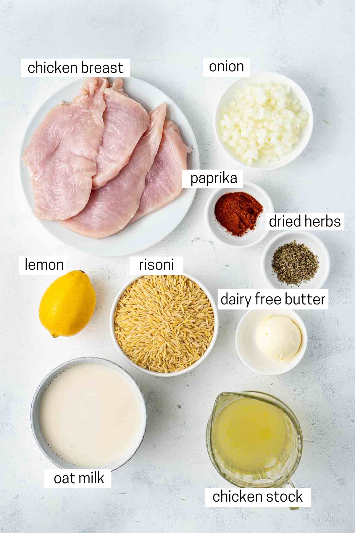 All ingredients needed to make creamy lemon risoni with grilled chicken laid out in bowls.