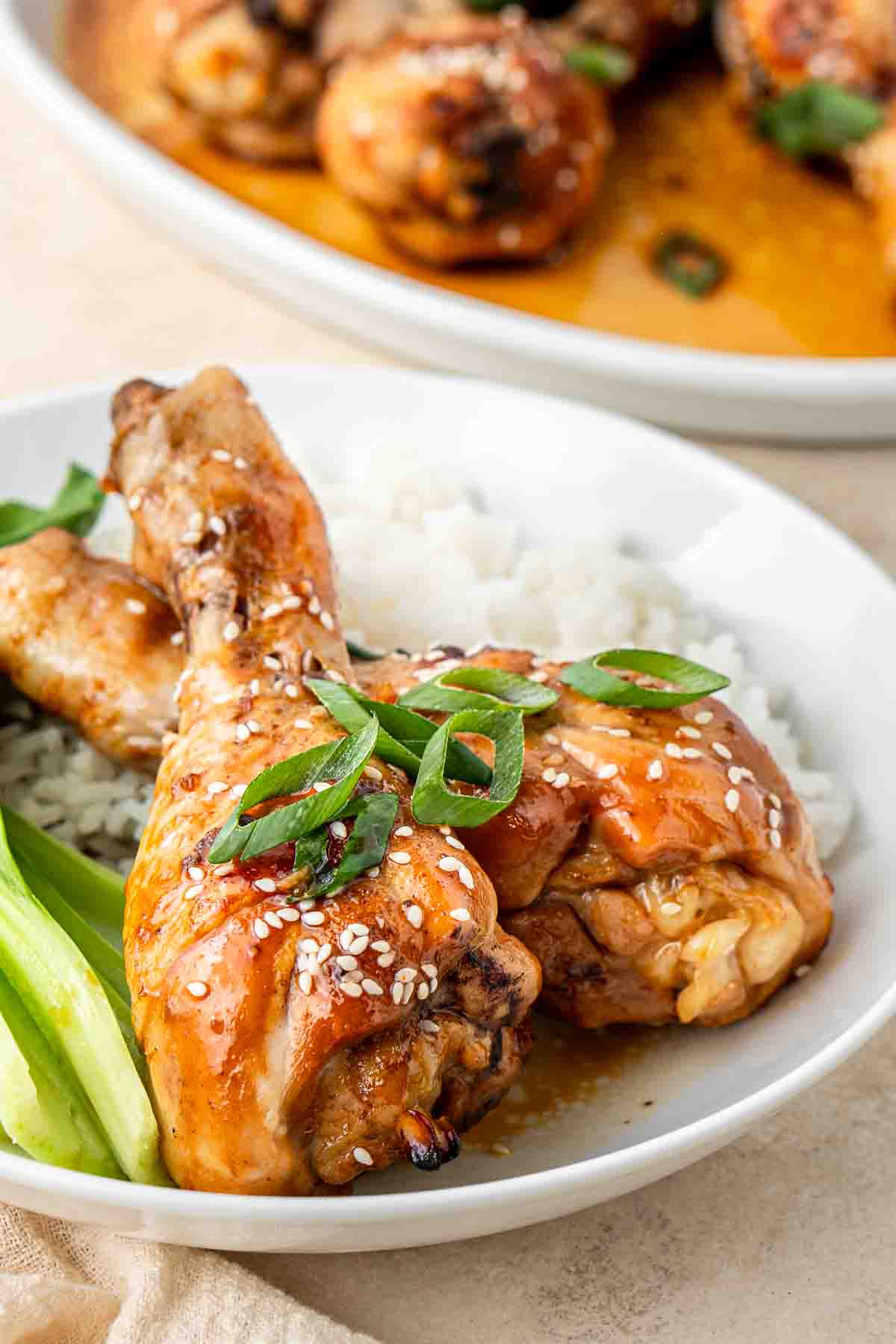 Chicken drumsticks served over rice with pak choy. 