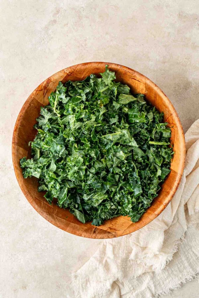 The finely chopped kale in a mixing bowl.