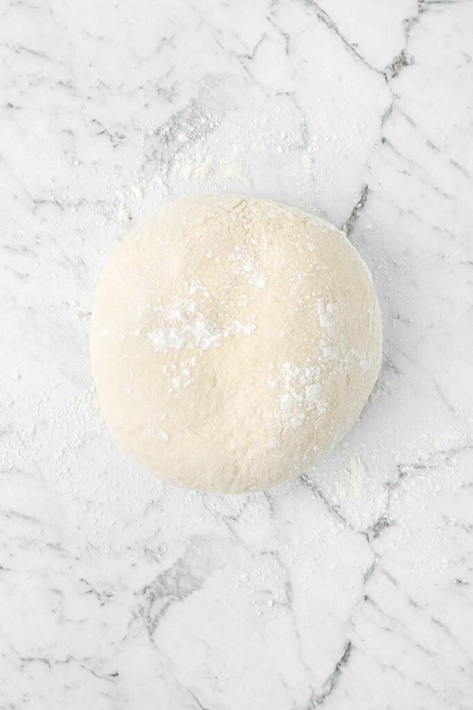 The kneaded pizza dough ready to rest.