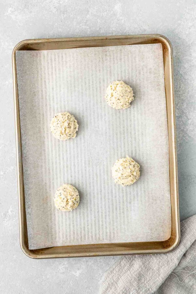 Ball of cookie dough on a baking tray.