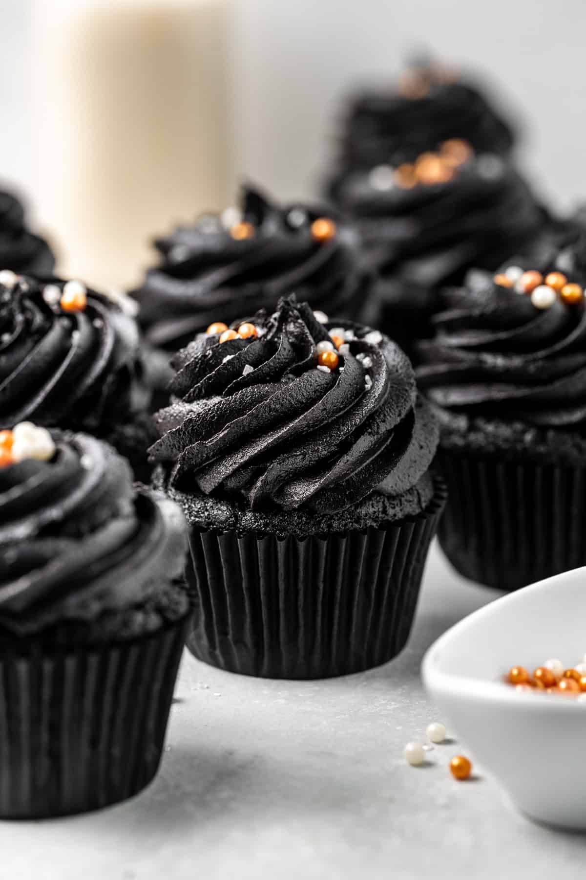 Black velvet cupcakes with black buttercream and sprinkles.