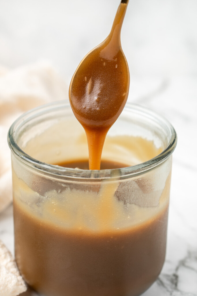 The homemade butterscotch sauce in a jar.