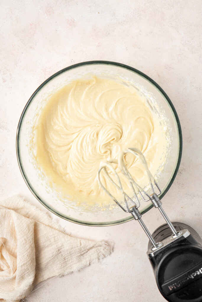 Beating together the cupcake batter.