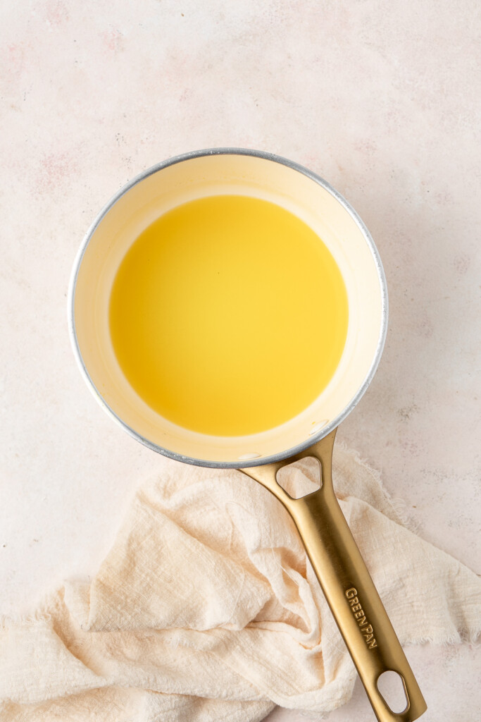 Reducing the creaming soda in a small saucepan.