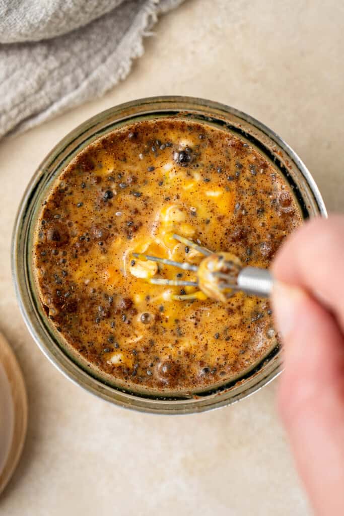 Whisking together the ingredients in a jar.