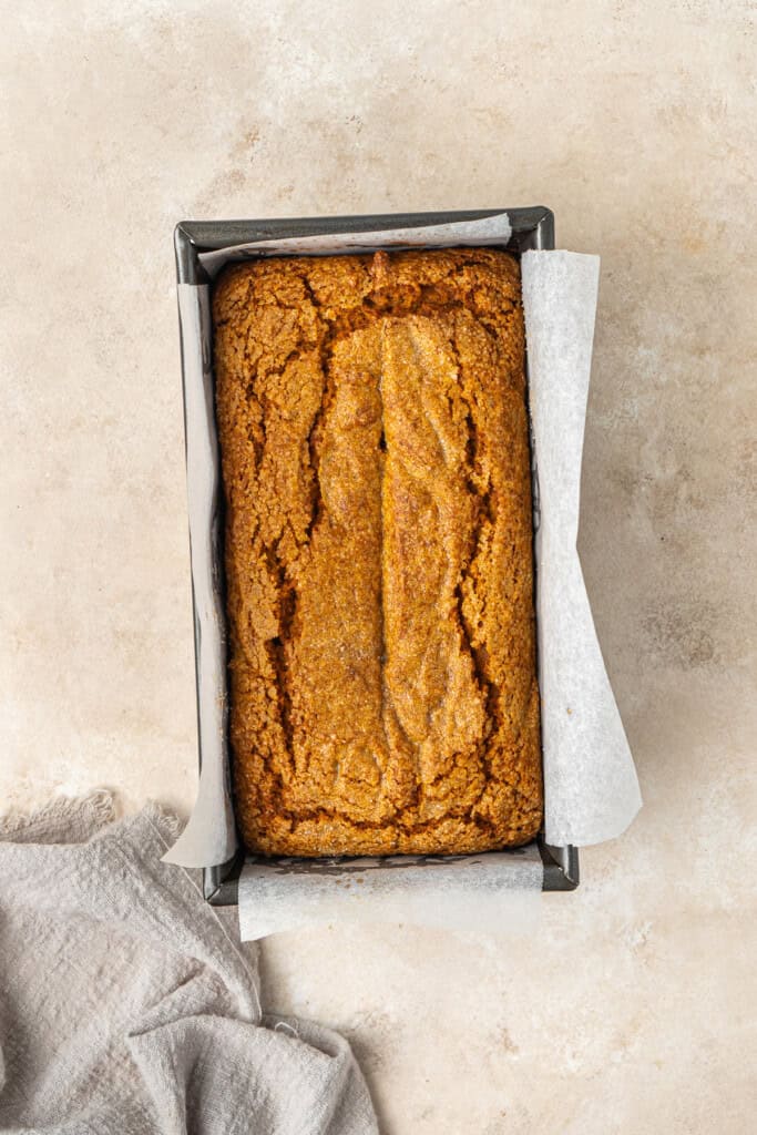 Baked pumpkin loaf in a pan.