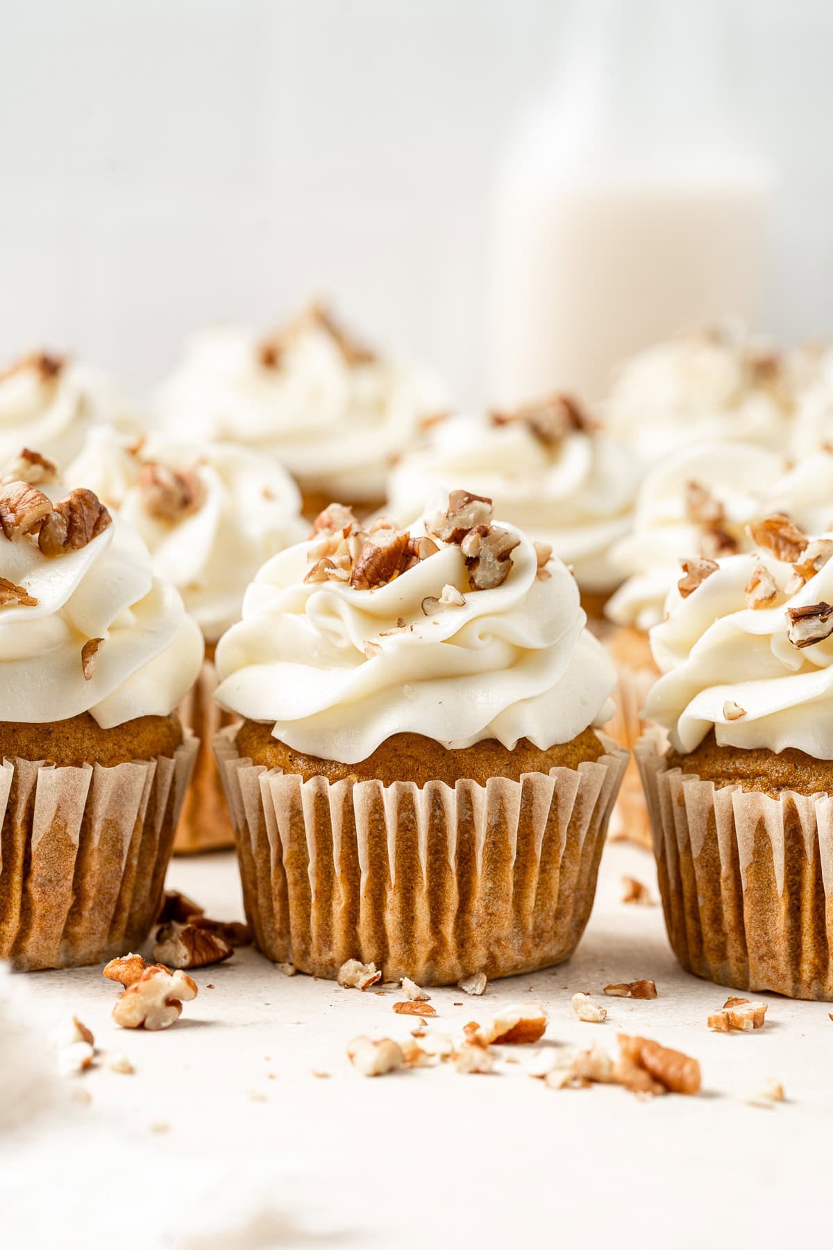 Vegan pumpkin cupcakes with cream cheese frosting.