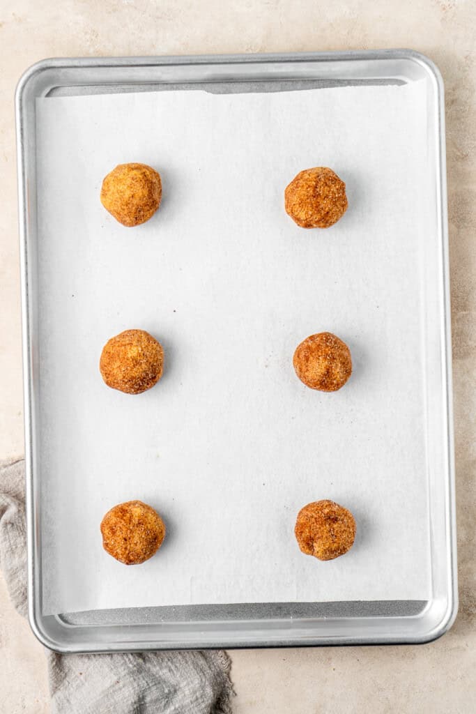 Ball of dough on a baking tray ready for the oven.