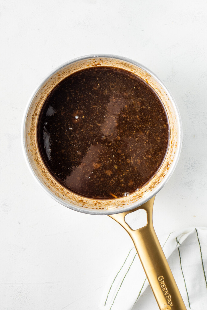 Cooking the glaze in a small saucepan.