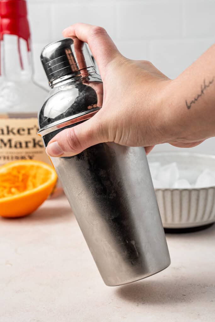 Shaking the cocktail in a cocktail shaker. 