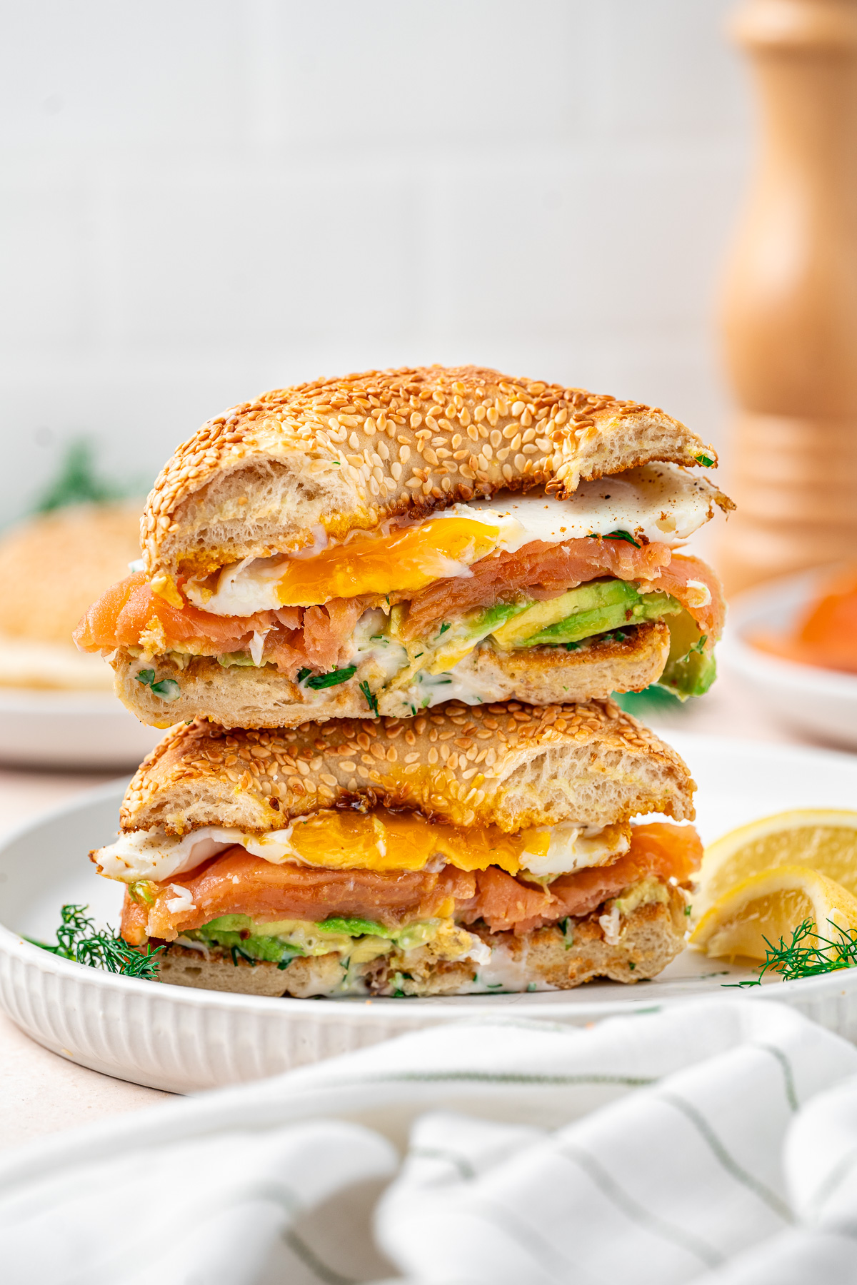 The smoked salmon breakfast bagel cut in half. 