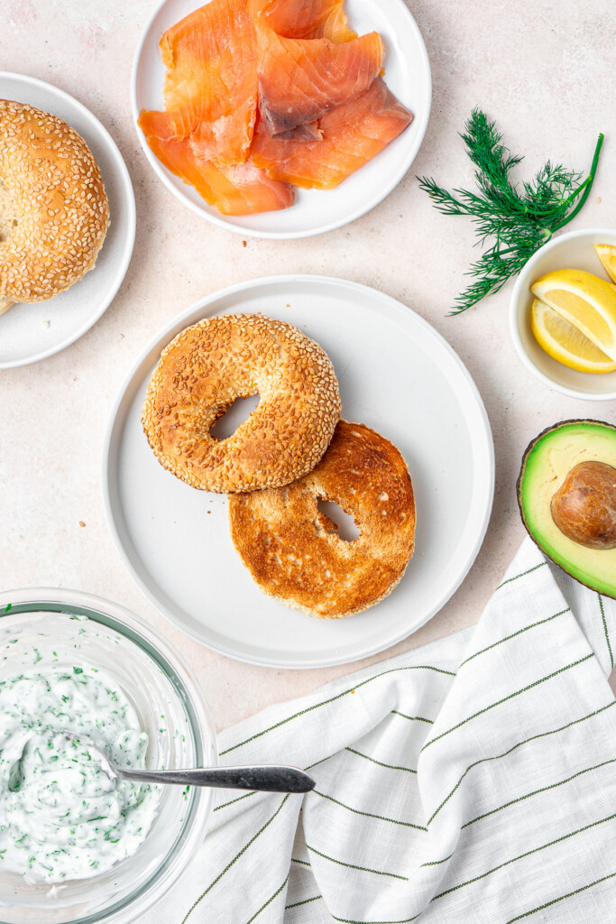 Toasted bagel and all filling ingredients laid out.