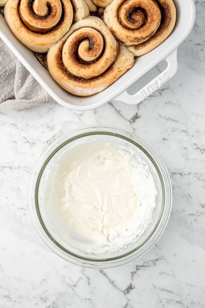 Making the icing for the cinnamon rolls.