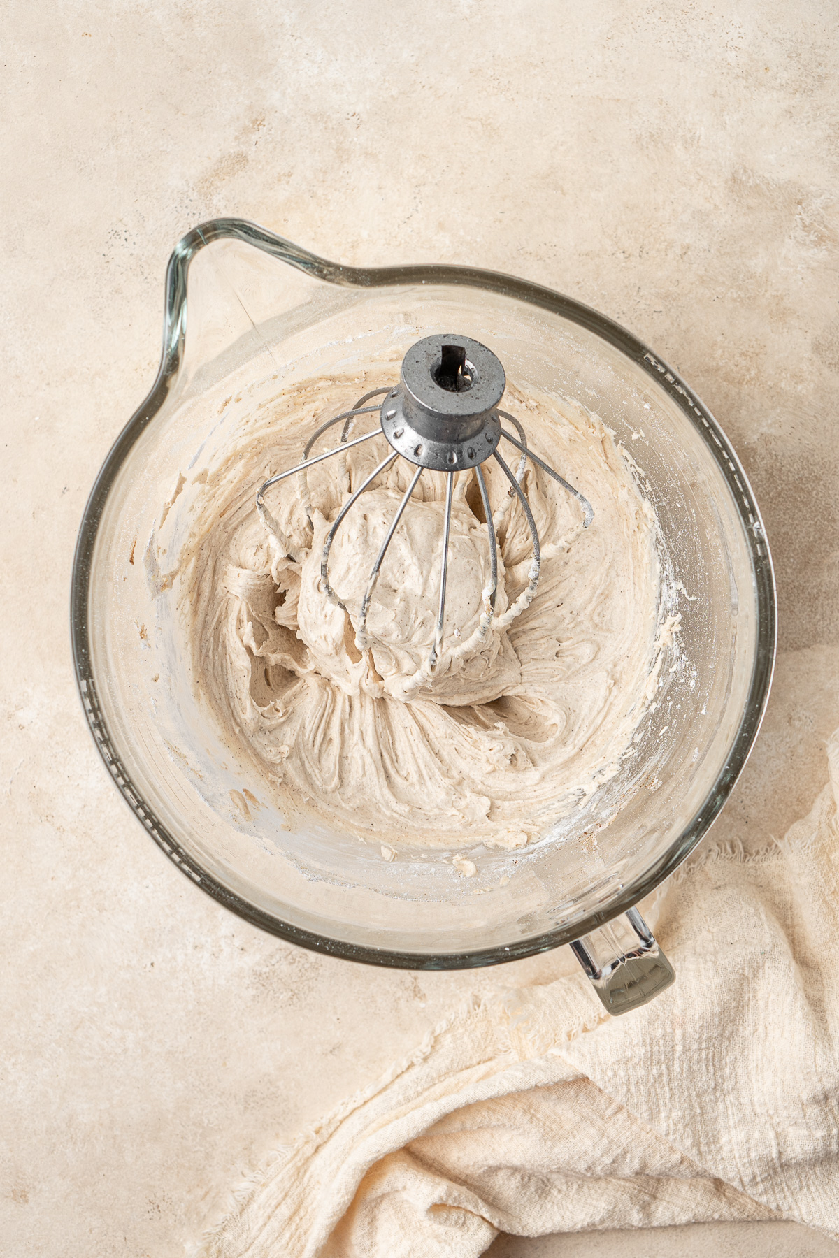 Dairy free cinnamon buttercream in the bowl of a stand mixer.