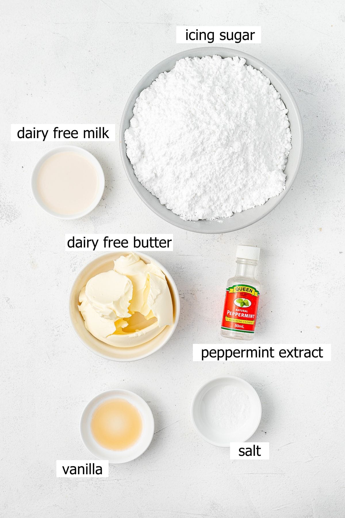 All ingredients needed to make vegan peppermint buttercream laid out in bowls.