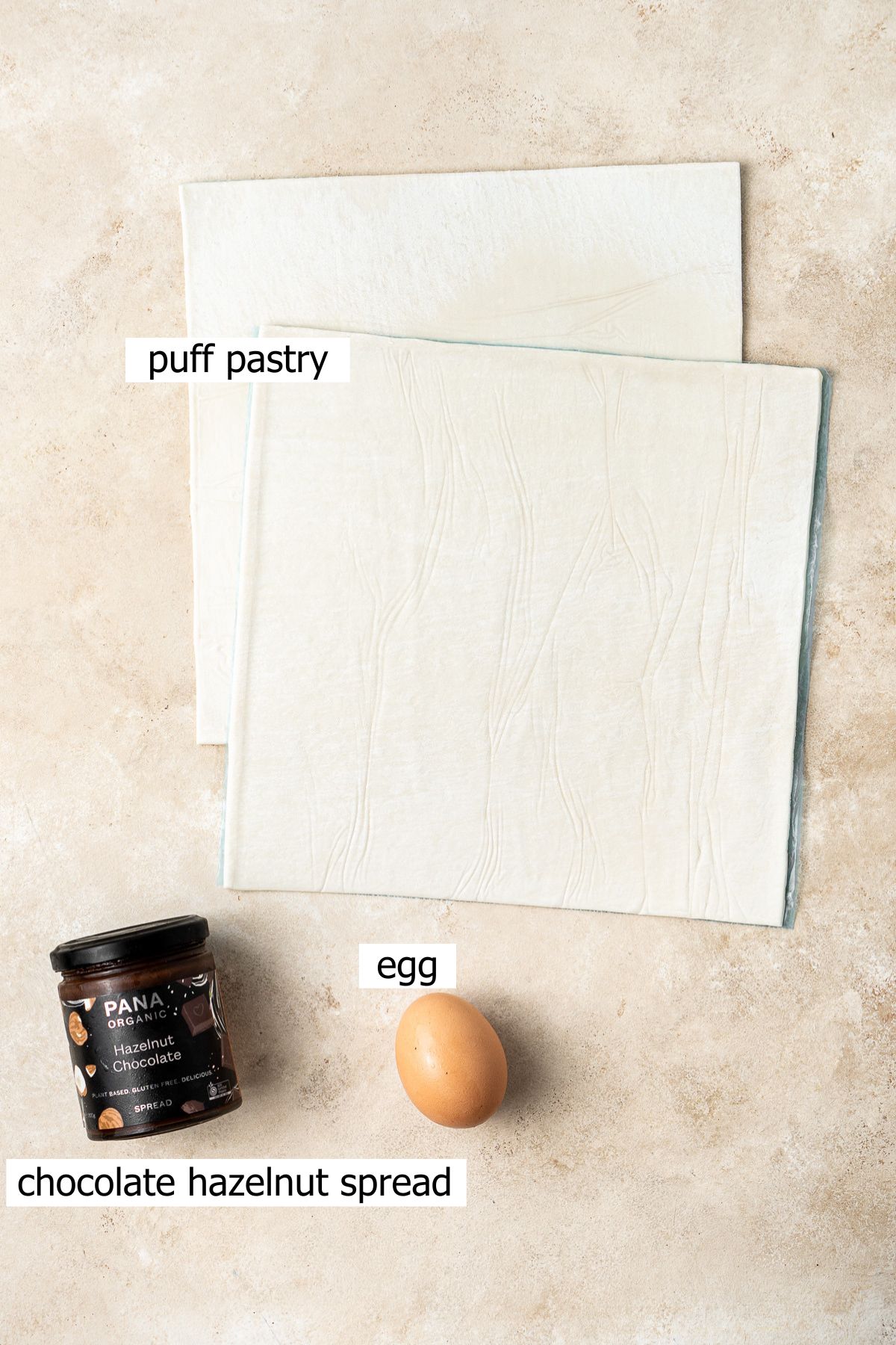 All ingredients need to make a chocolate puff pastry Christmas tree laid out.