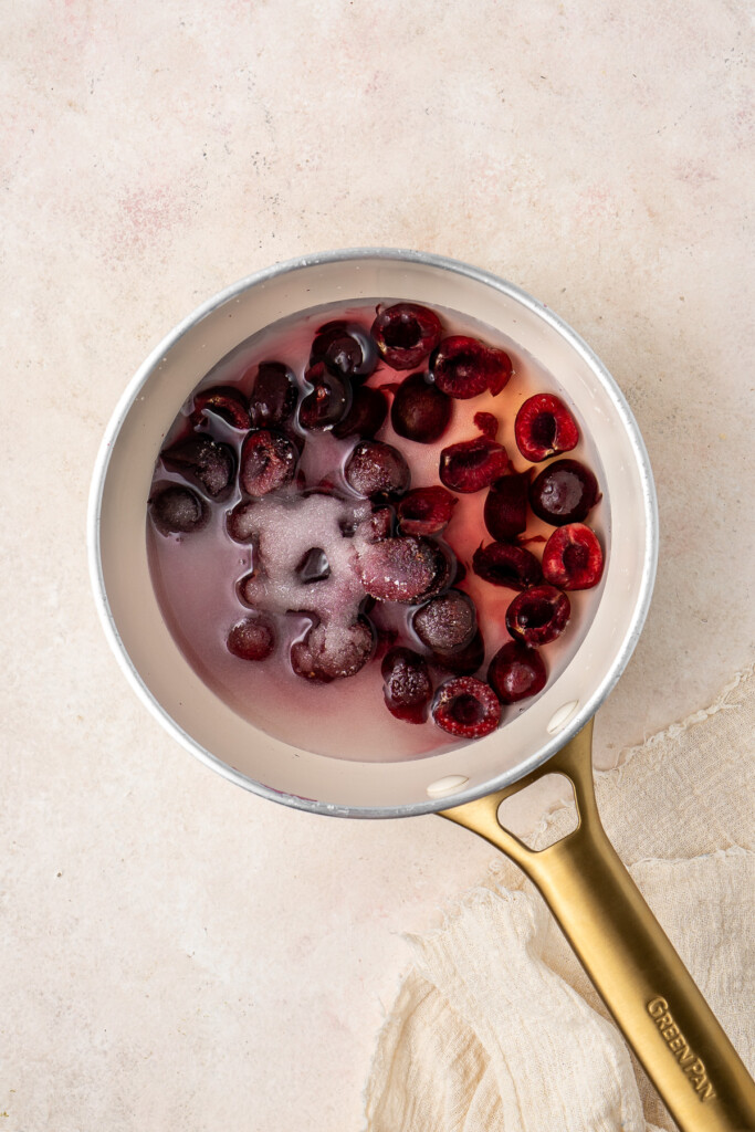 The cherry syrup ingredients in the saucepan.