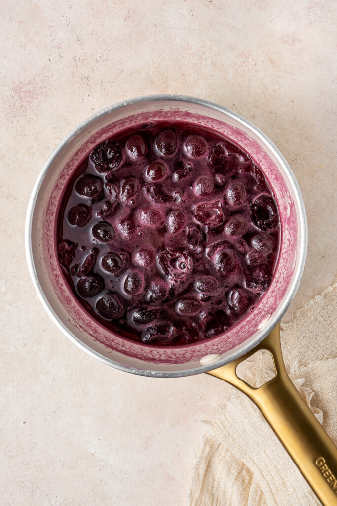 The cherry syrup in a saucepan before being strained. 