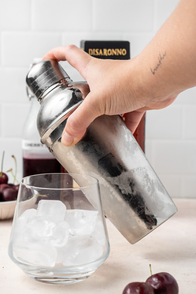 Shaking the cocktail in a shaker.