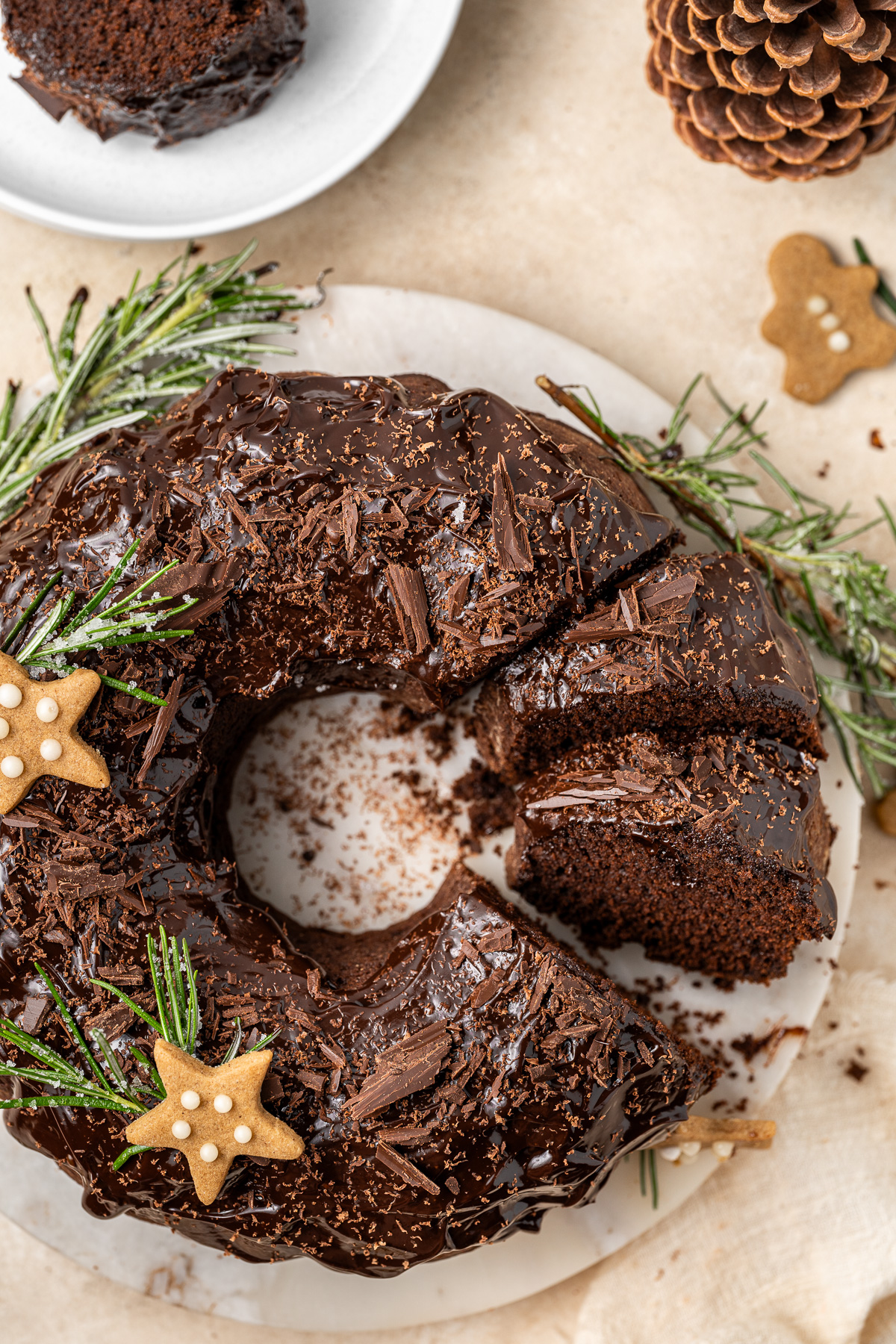 Close up of the chocolate gingerbread bundt cake sliced and decorated for Christmas.