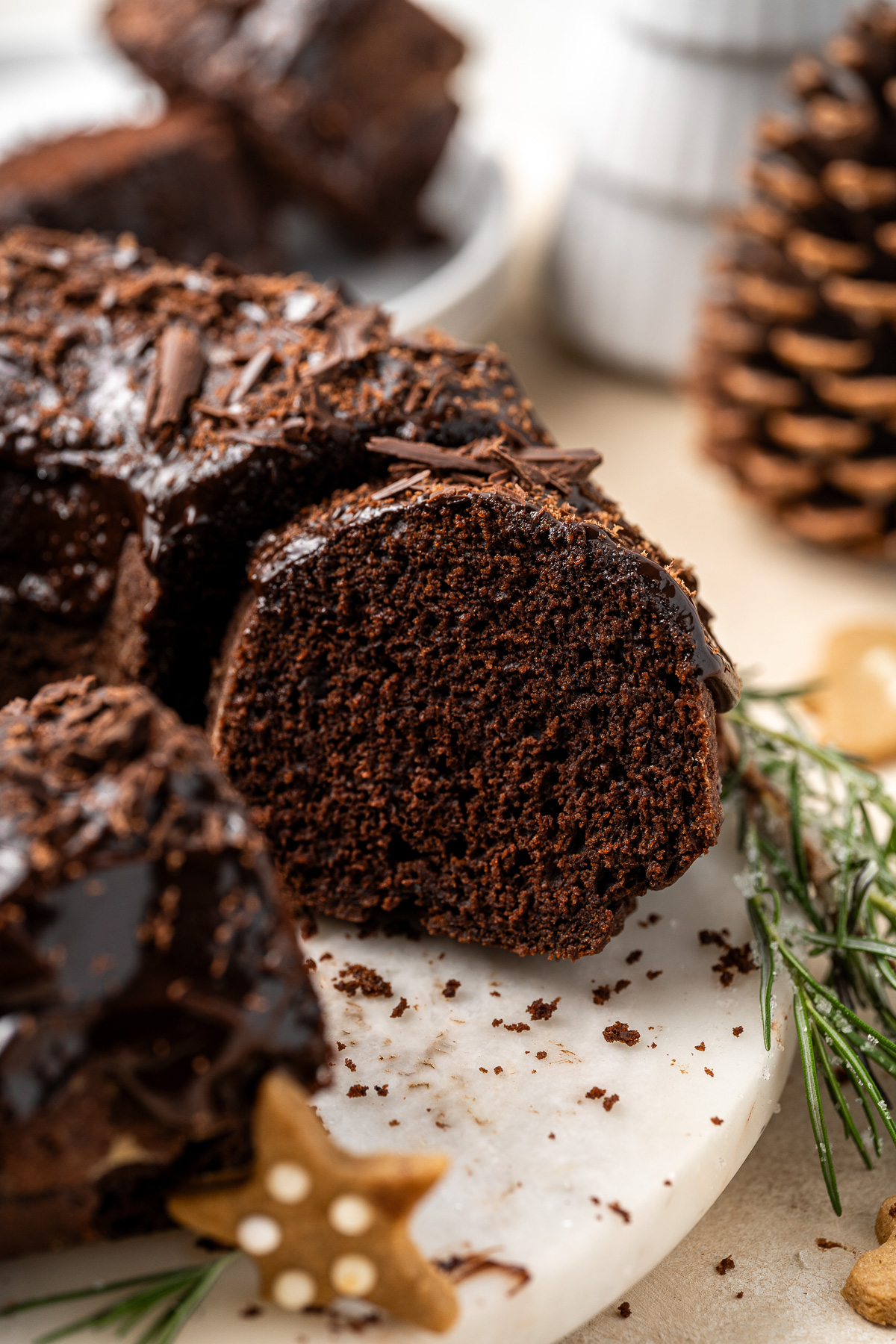 A close up of a slice of chocolate gingerbread bundt cake.