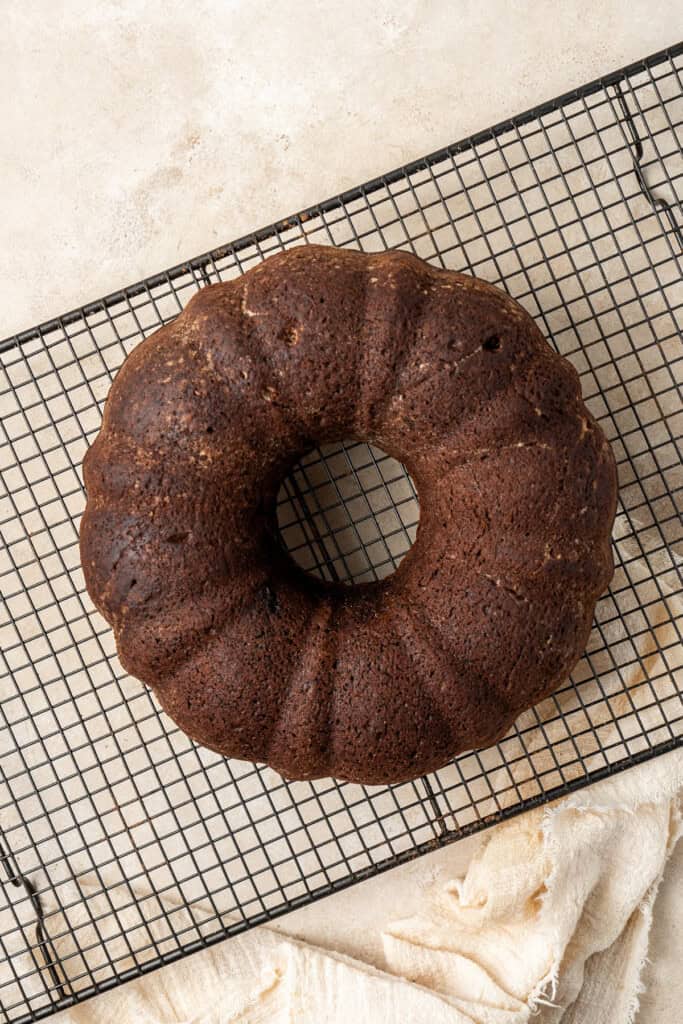 The turned out cake on a wire cooling rack.