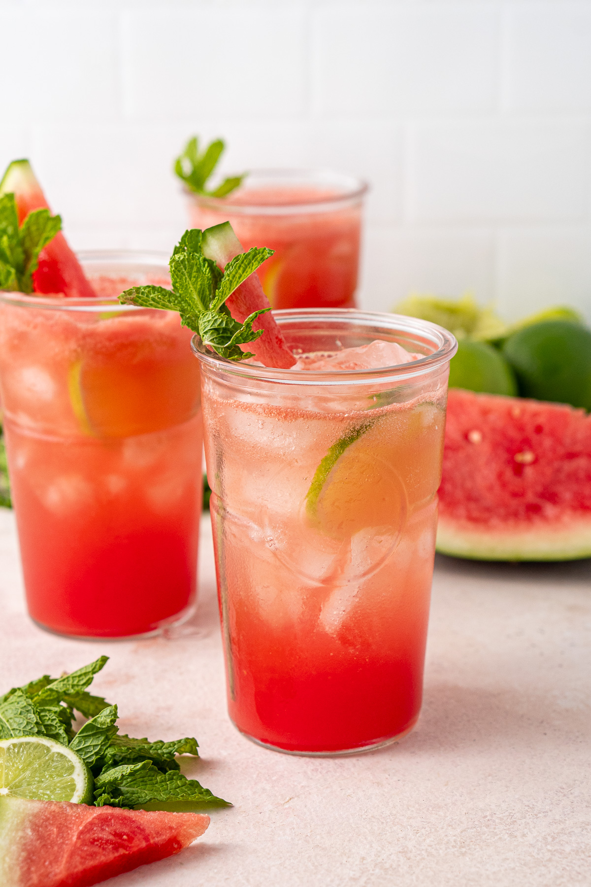 Sparkling watermelon lime mocktails in glasses with fresh mint.