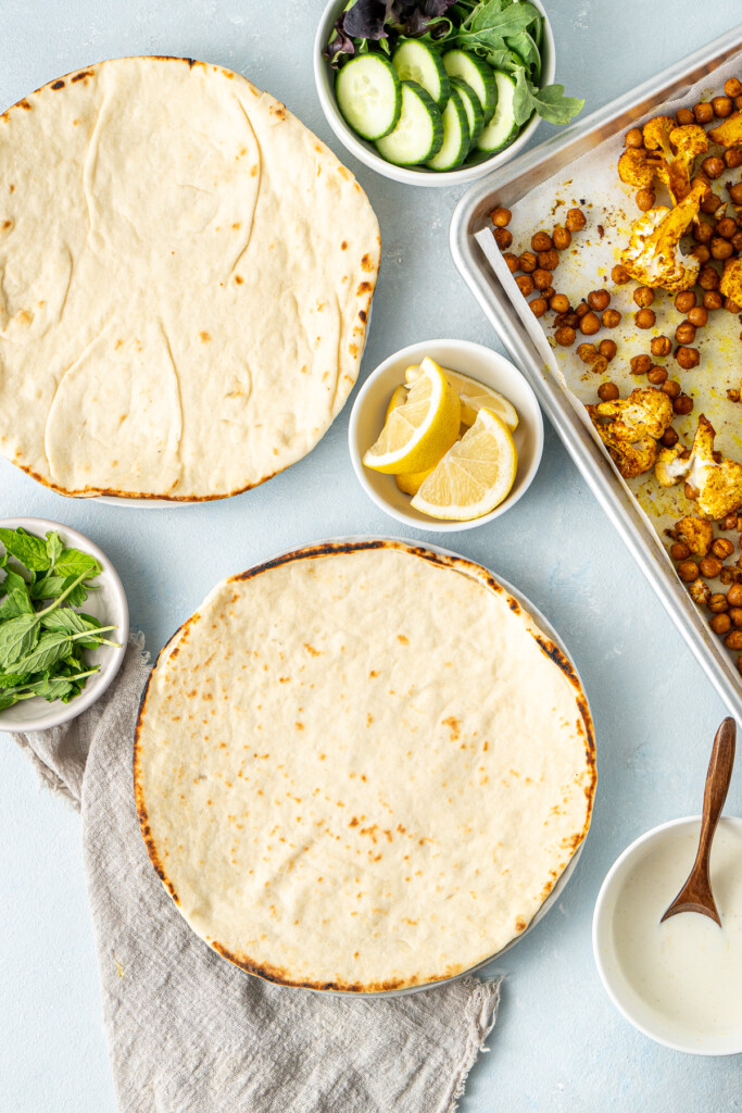 The pita bread and toppings ready to assemble. 