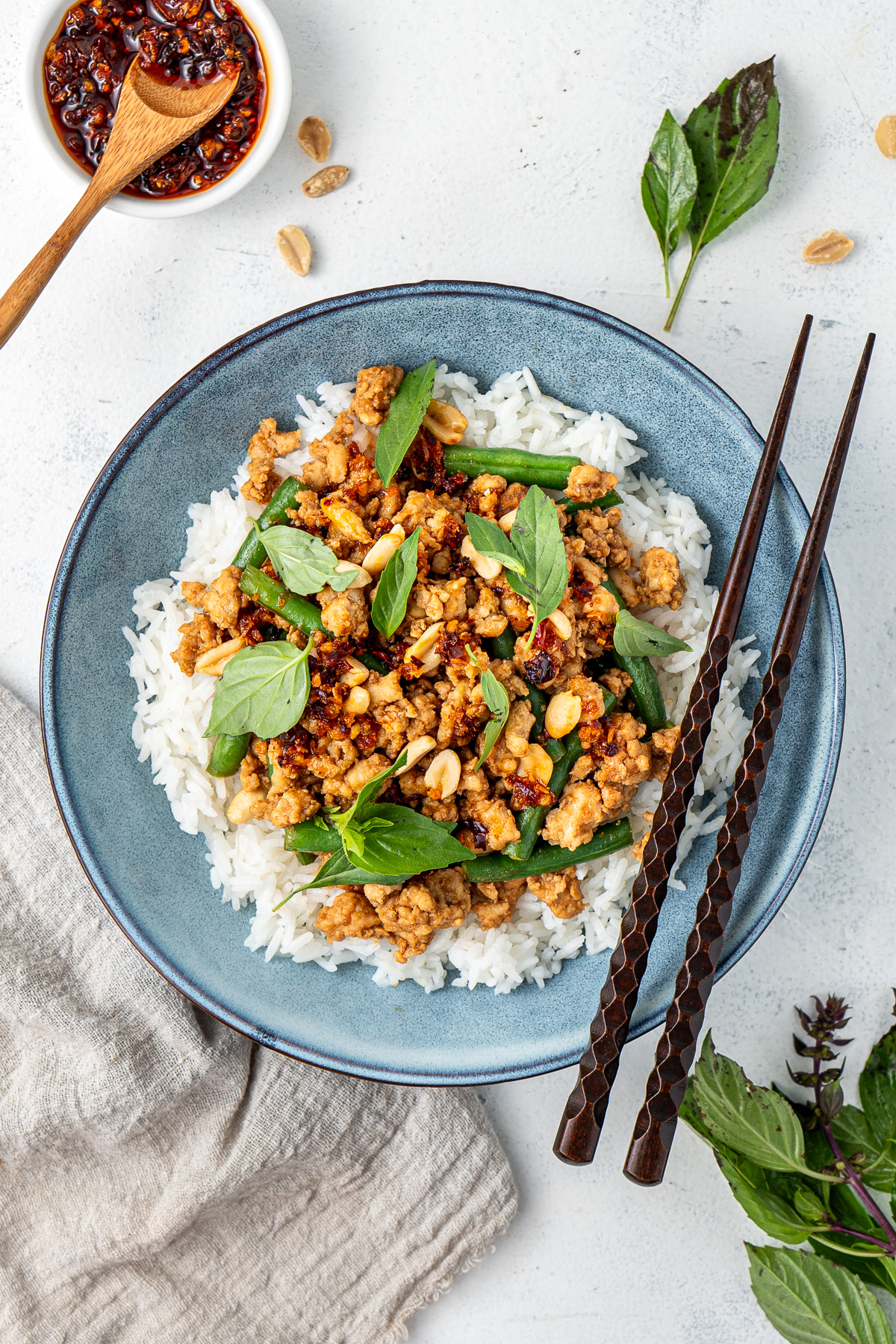 Hoisin chicken stir fry served over rice with chilli oil and Thai basil.