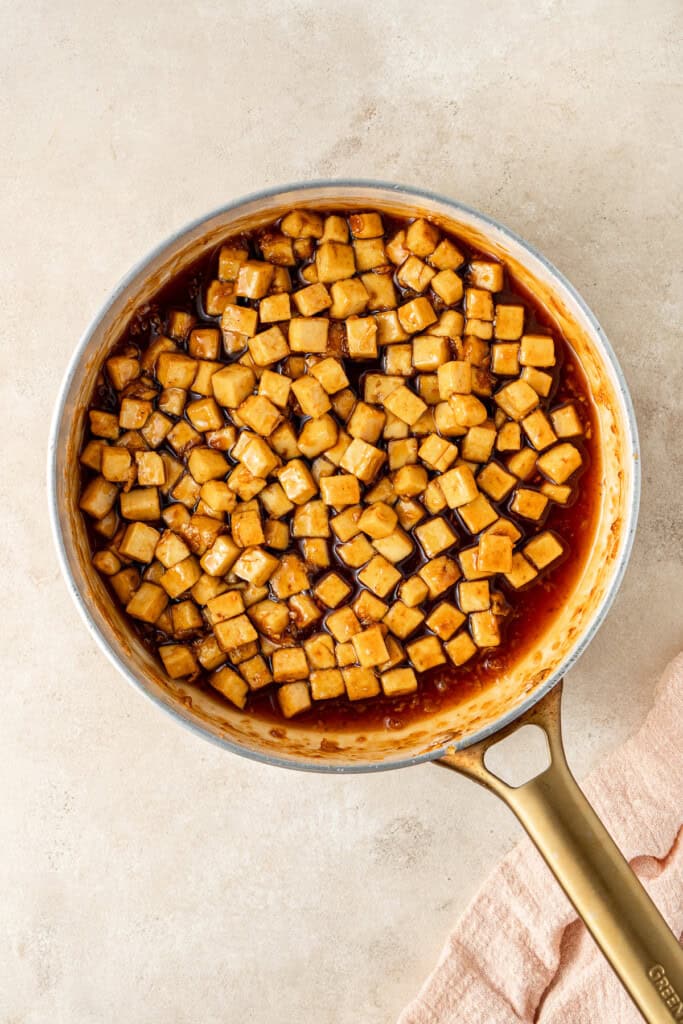 The honey garlic tofu and sauce in a pan.