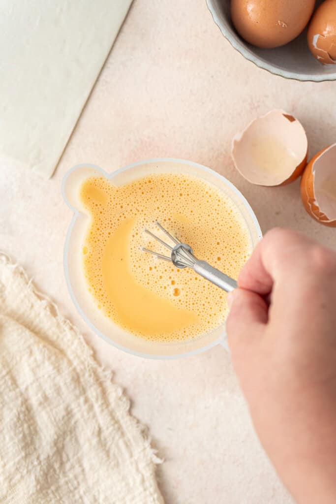 Whisking up the egg mixture.