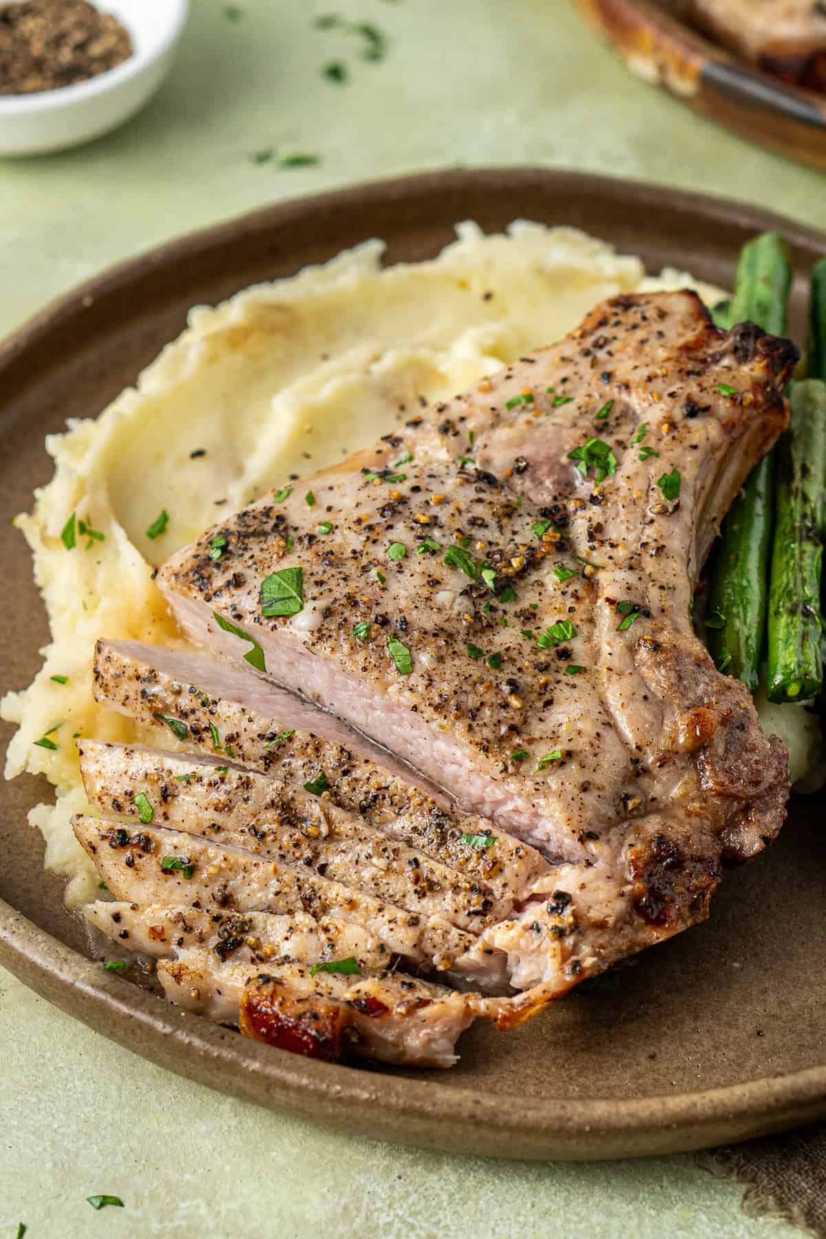 Close up of the sliced pork chop showing how juicy it is.