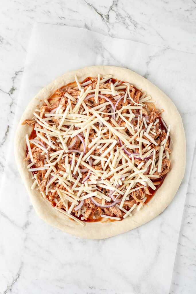 Homemade pizza with toppings ready for the oven.