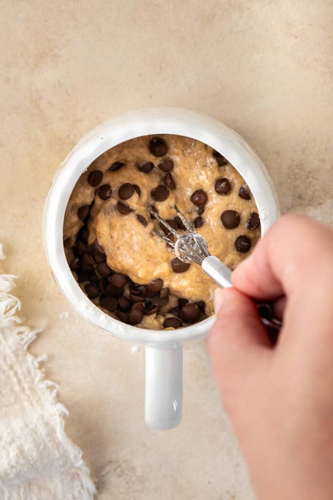 Mixing together the mug cake batter.